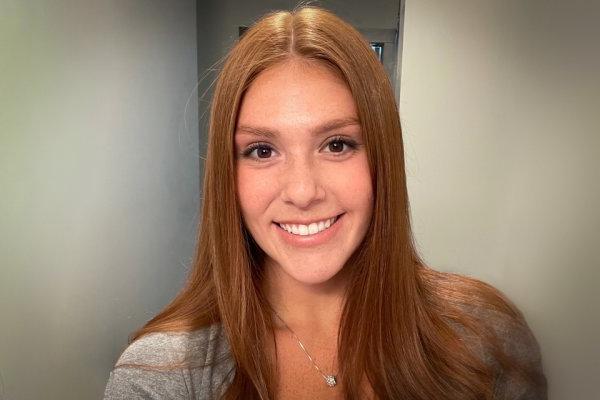 Headshot of Maryanne Lazore '21, smiling at camera in hallway.