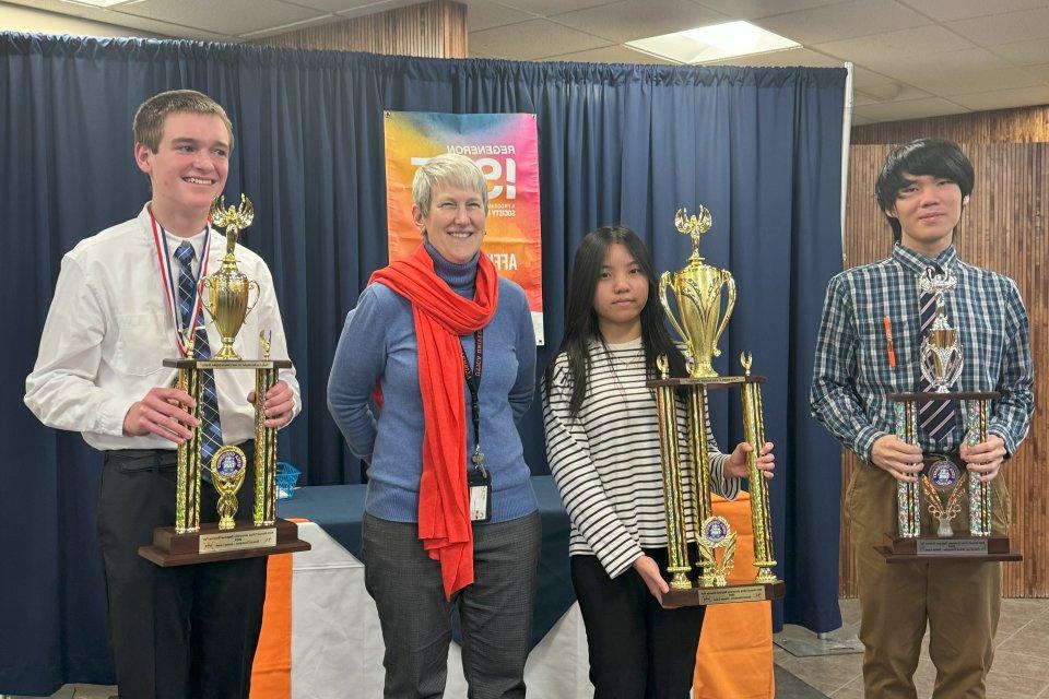 Provost Stephanie Nesbitt stands with winners of the 2024 Regional Science Fair.